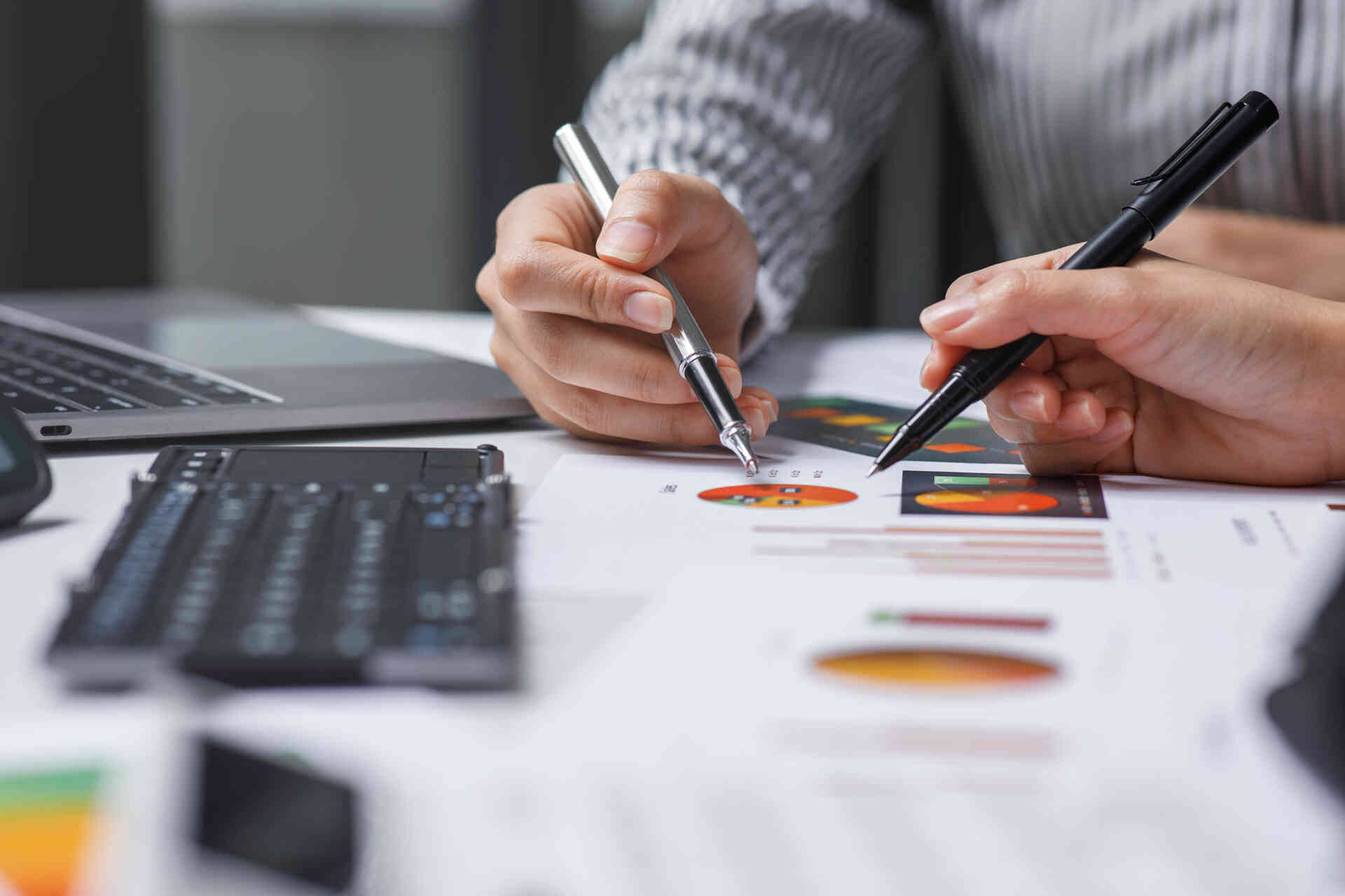 Business team working at office with documents on his desk, doin flow meter proving