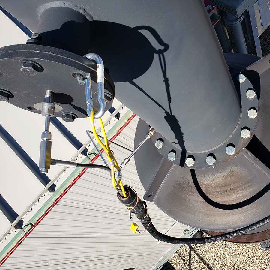 Pilot assembly with ignition electrode and gas line at the base of a flare stack
